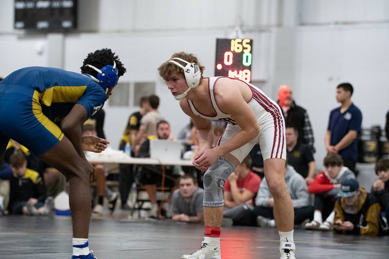 Wheaton Academy's Tyler Jones, right, and Altoff Belville's Pierre Walton wrestle in the 165-pound championship match during the Reed-Custer Comet Classic Wrestling Invite on Saturday, Jan 17.