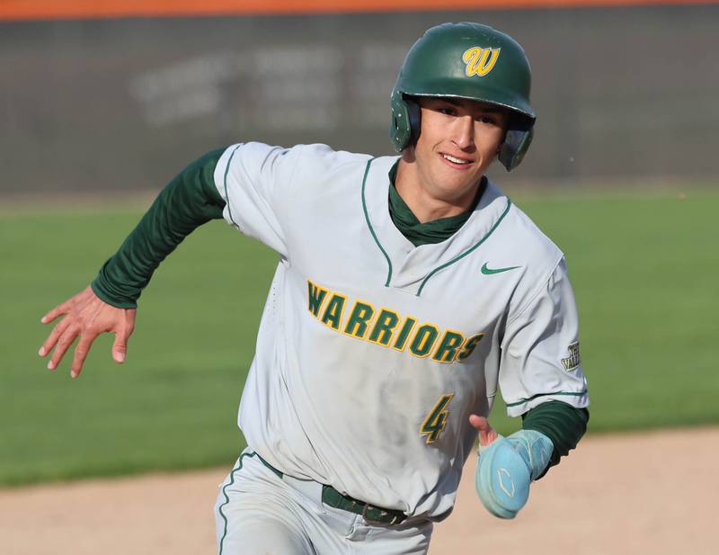 Waubonsie Valley's Scott Gillen rounds third base on his way to scoring Monday, April 20, 2026, during their game at DeKalb High School.