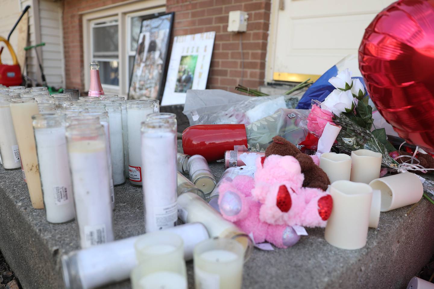 A vigil is set up on the porch of the victims home from Romeo Nance mass shooting on Thursday, Feb. 8th 2024 in Joliet.