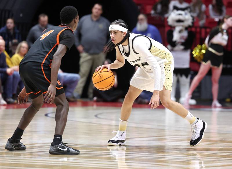 Sycamore's Unique Shaw works against DeKalb's Marquise Bolden during their game Friday, Jan. 31, 2025, in the FNBO Challenge in the Convocation Center at Northern Illinois University in DeKalb.