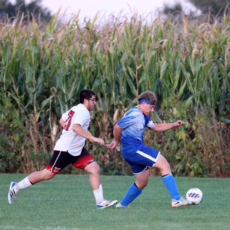 Hinckley-Big Rock's Luke Badal kicks the ball ahead of Indian Creek's Antonio Bonilla during their game Wednesday, Oct. 2, 2024, at Hinckley-Big Rock High School.
