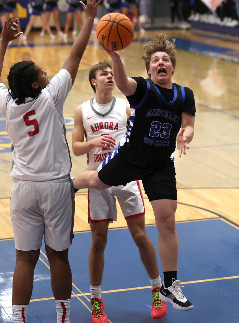 Hinckley-Big Rock's Luke Badal drives to the basket past Aurora Christian's Jordan Weeks during their sectional final game Friday, March 7, 2025, at Somonauk High School.