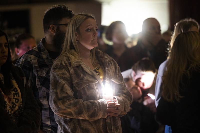 Amazing Grace is played at the start of a vigil Sunday, March 31, 2024 in Tampico for three local boys who died in a Thursday collision.