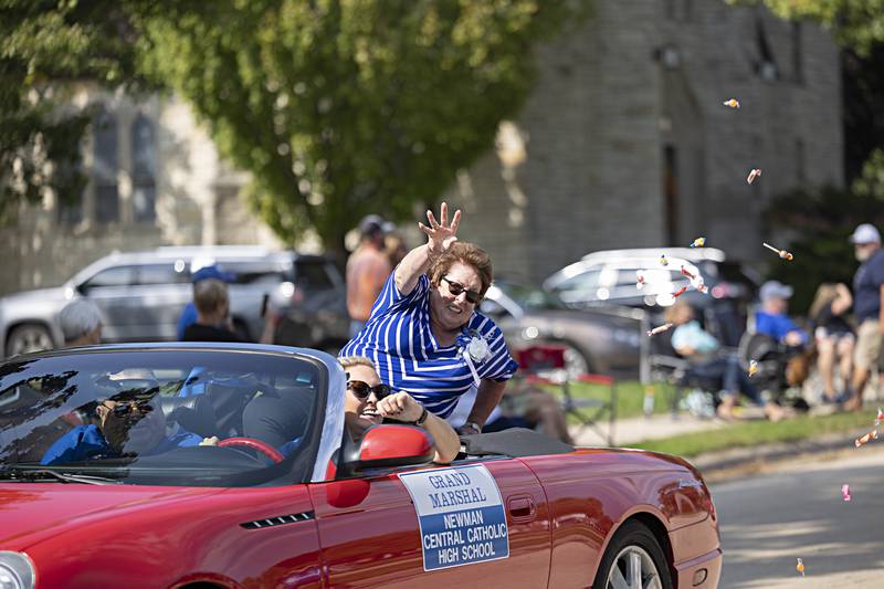 Marianne Hoffmiller throws out candy Friday, Sept. 29, 2023 during the Newman High School homecoming parade. John and Marianne were chosen as grand marshals of the 2023 parade.