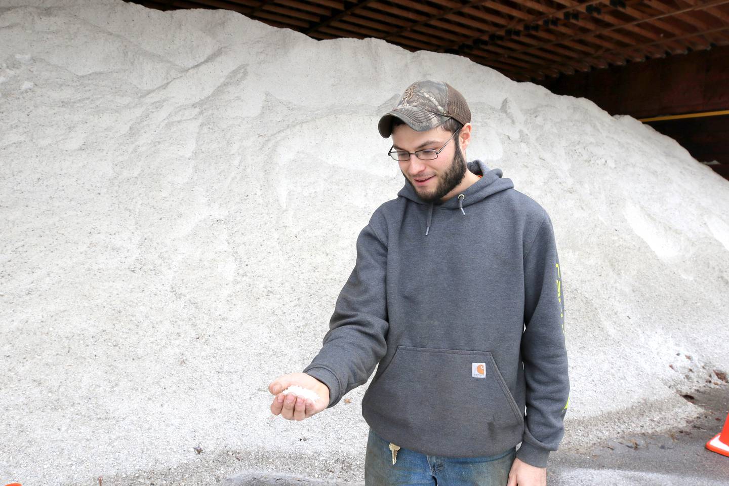 T.J. Scholl, with the DeKalb County Highway Department shows some of the salt Tuesday, Dec. 20, 2022, at the county highway department location in DeKalb, that will be used this winter to make the county roads safer. A significant winter storm is expected Thursday and Friday that will blanket the area with several inches of snow.