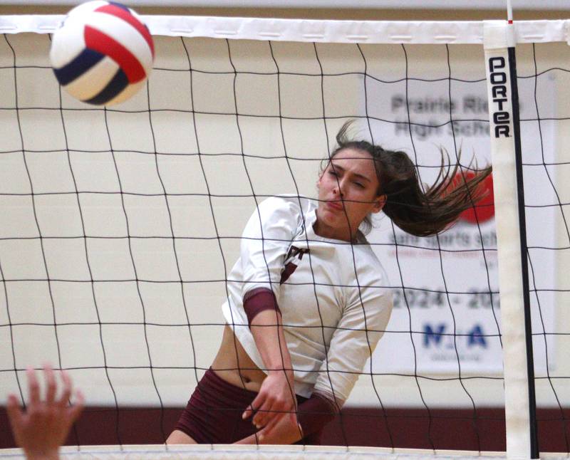 Prairie Ridge’s Maizy Agnello sends the ball over the net against Hampshire during varsity volleyball on Thursday, Oct. 3, 2024, at Prairie Ridge High School in Crystal Lake.