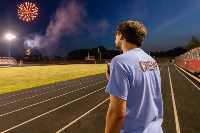 Fireworks burst as Kaedon Cronkright finishes singing the National Anthem at the start of the show at Bill Novak Field on July 4, 2025 at Ottawa High School.