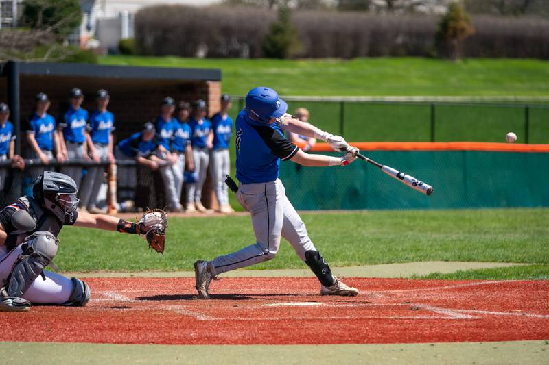 St. Charles North's Jayden Lobliner (4) homers against St. Charles East during a baseball game at St. Charles East High School on Saturday, May 7, 2022.