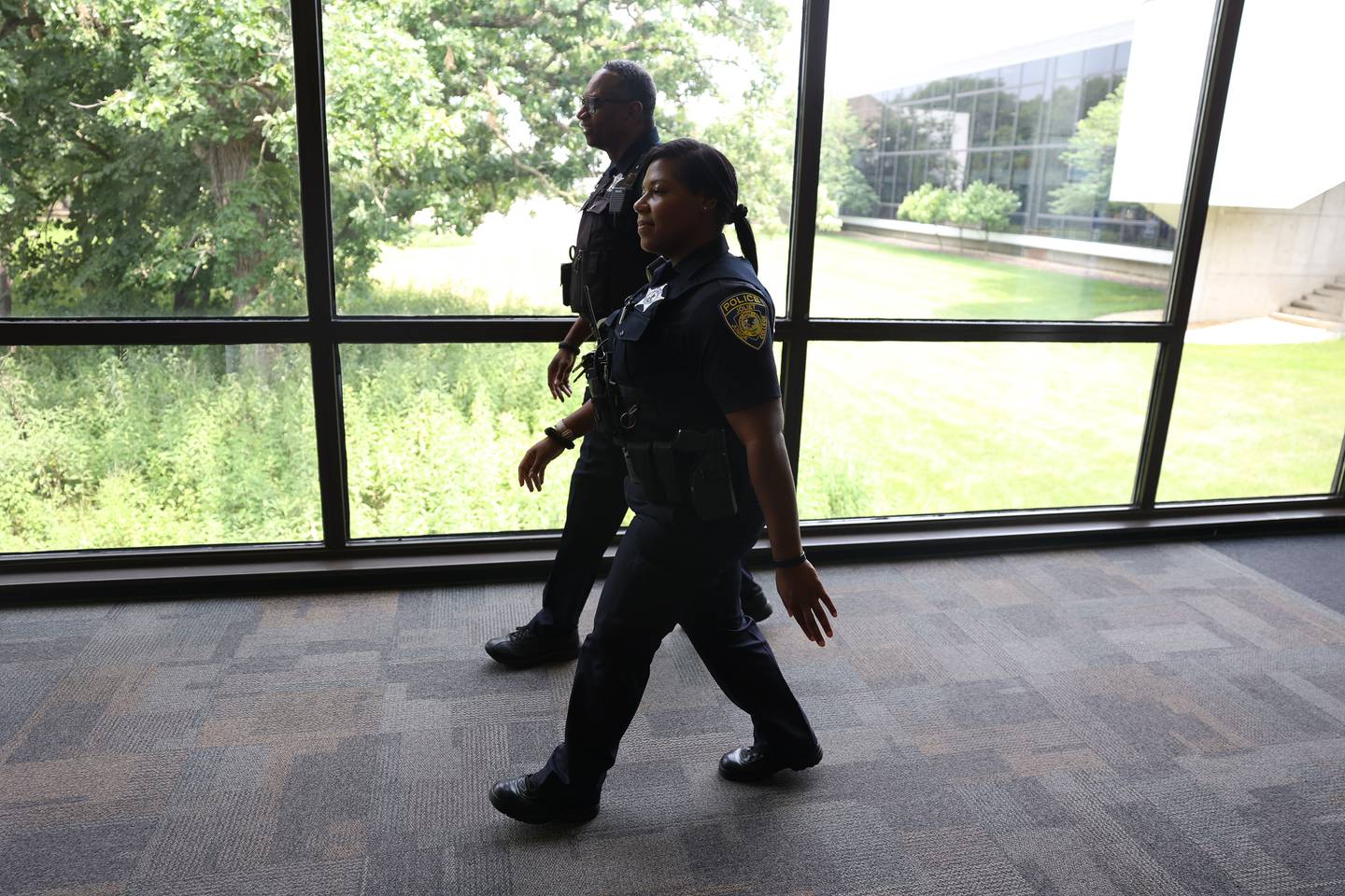 Joliet Junior College Officer Destiny Griffin patrols the campus halls with her field training officer Detective Joe Eckols on Wednesday, July 26 in Joliet.