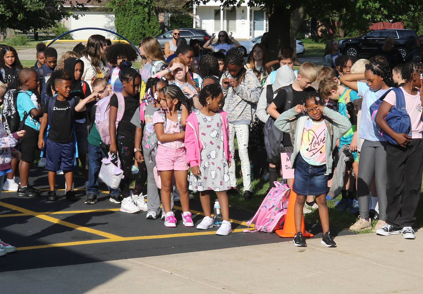 Lincoln Elementary School students line up Wednesday, Aug. 14, 2024, outside the school in DeKalb as they arrive for their first day.