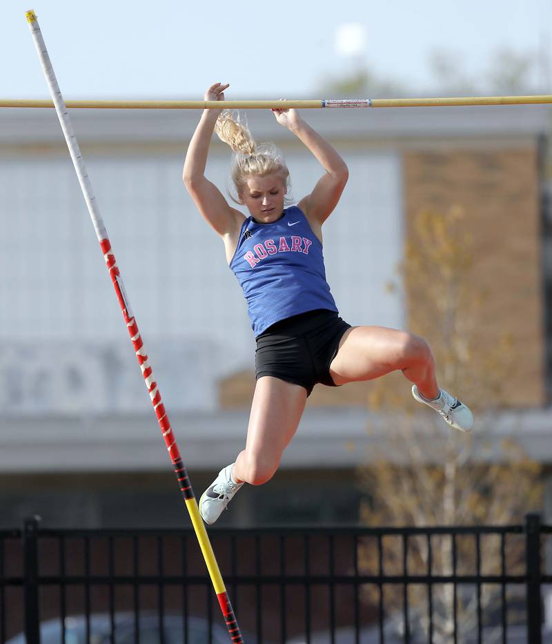Libby Saloga, of Rosary competes in the pole vault during the Kane County girls track and field meet Thursday April 27, 2023 in Aurora.