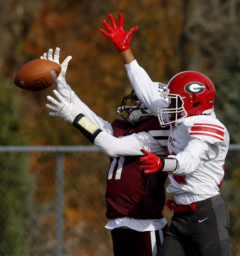 Prairie Ridge's Ben Gablenz tries to intercept a pass intended for Chicago Goode's Dorrell Ries during an IHSA Class 5A first-round football game on Saturday, Nov. 2, 2024, at Prairie Ridge High School in Crystal Lake.