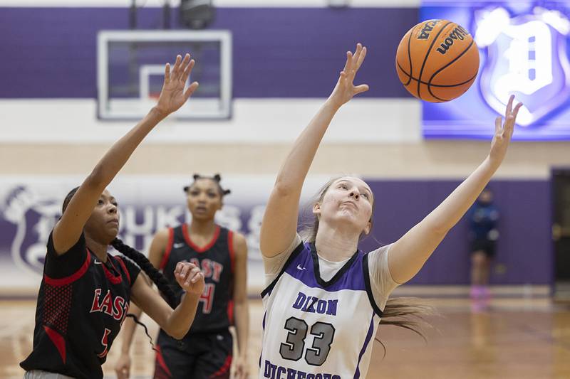 Dixon’s Lucy Feick hauls in a rebound against Rockford East Monday, Feb. 16, 2026.
