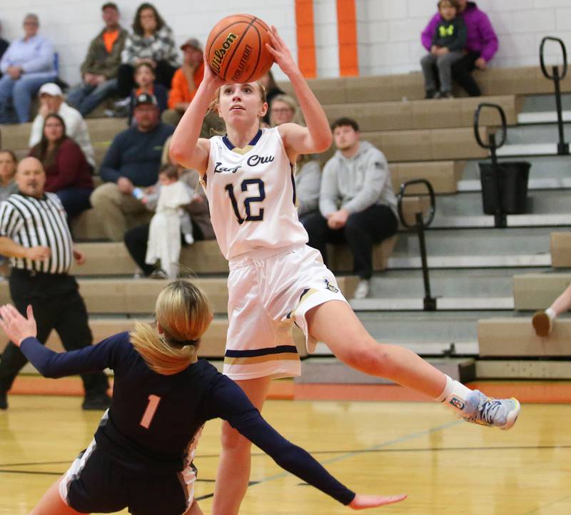 Marquette's Lilly Craig draws a charging foul on Fieldcrest's Kaitlin White during the Integrated Seed Lady falcon Basketball Classic tournament on Monday, Nov. 13, 2023 at Flanagan High School.