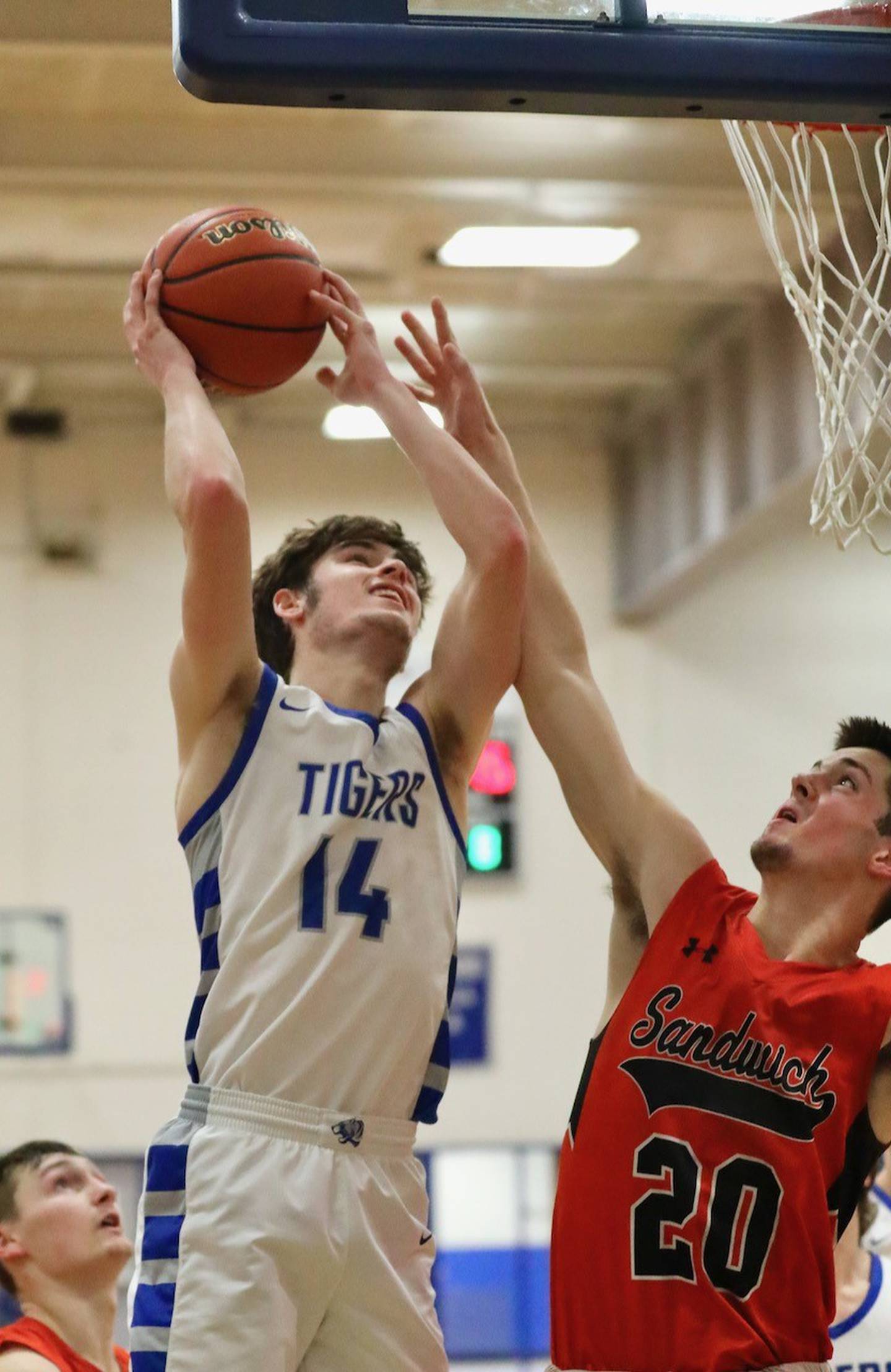 Princeton's Grady Thompson shoots over Sandwich's Owen Sheely Tuesday at Prouty Gym. The Tigers won 60-43.