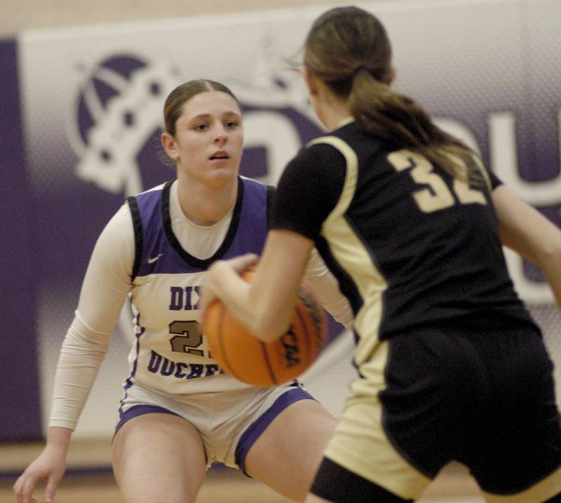 Dixon's Presley Lappin defends the ball against Sycamore's  Quinn Carrier. The Dixon Duchesses beat the Sycamore Spartans 55-47 in a non-conference game played at Lancaster Gym in Dixon on Saturday, December 20th, 2025.