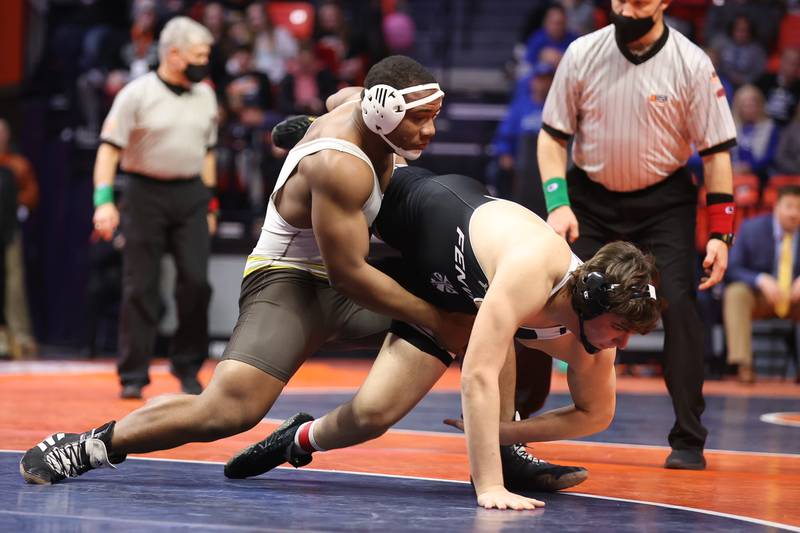 Joliet Catholic’s Dillan Johnson throws Fenwick’s Jimmy Liston to the mat in the Class 2A 285lb. championship match at State Farm Center in Champaign. Saturday, Feb. 19, 2022, in Champaign.
