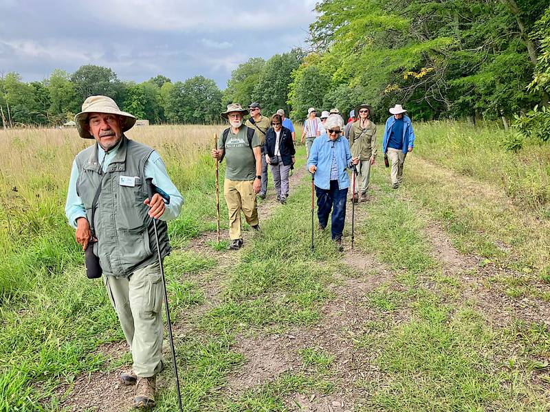 Naturalist Joe Jakupcak, a retired Ottawa High School geology teacher, leads one of the four hikes Saturday, Aug. 26, 2023, marking the 10th anniversary of the founding of the Dayton Bluffs Preserve in Ottawa.