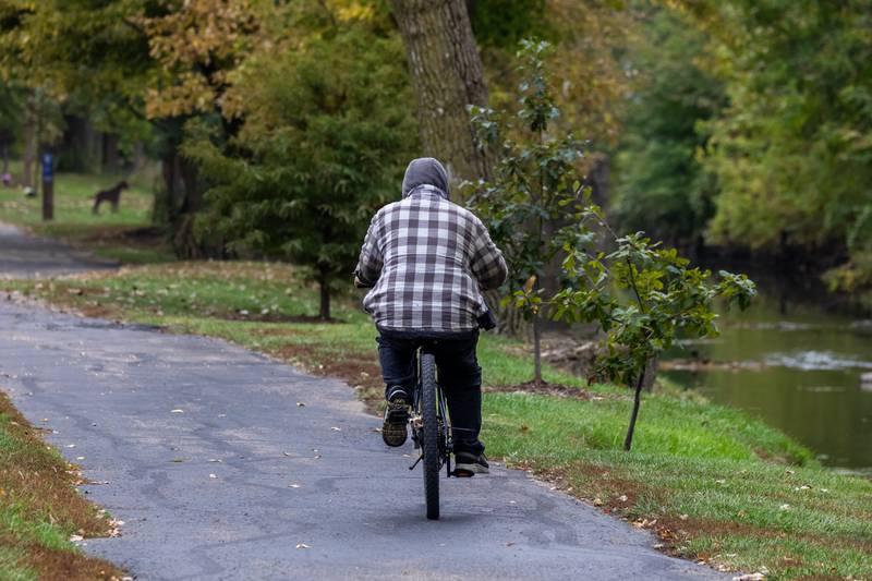 A cyclist enjoys the I&M Canal path in Lockport on Oct. 15, 2025.
