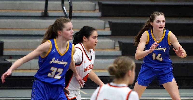Johnsburg’s Skye Toussaint, left, and Summer Toussaint, right, play defense in varsity girls basketball on Saturday, Jan. 4, 2025, at McHenry High School in McHenry.