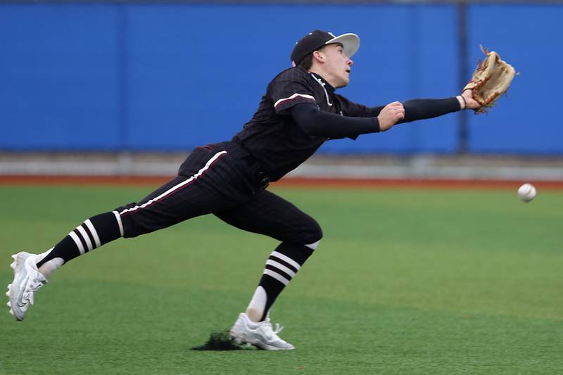 Marengo's Robert Heuser just can’t com up with a fly ball during a Kishwaukee River Conference baseball game against Johnsburg on Monday, April 21, 2025, at Johnsburg High School.
