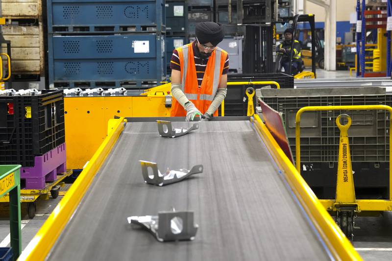 FILE -  An employee works on the production line at the Martinrea auto parts manufacturing plant that supplies auto parts to Canada and U.S. plants, in Woodbridge, Ontario, Monday, Feb. 3, 2025. (Chris Young/The Canadian Press via AP, File)