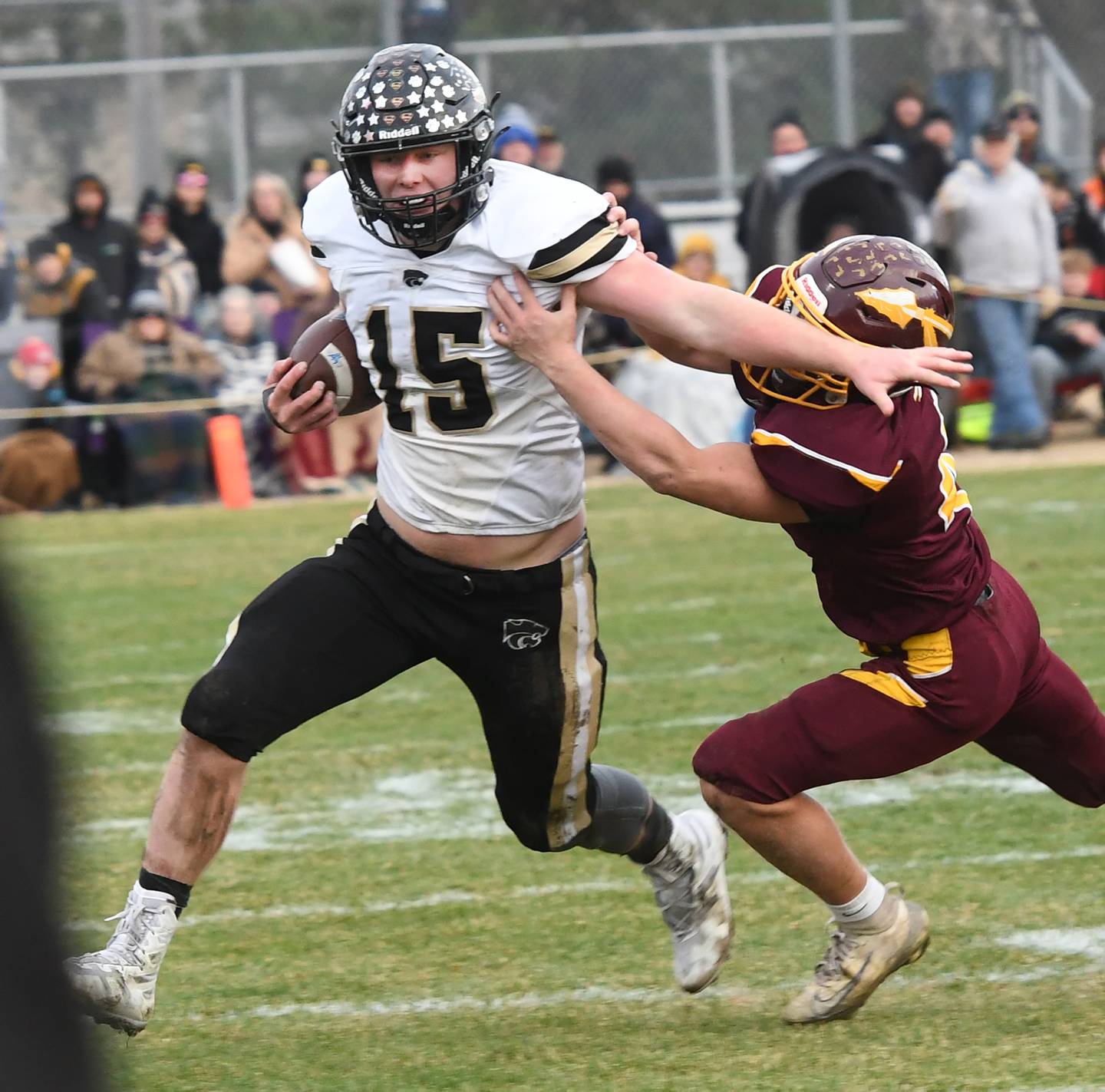 Lena-Winslow's Koby Kearns (15) fights off a Stockton defender in 1A semifinal action in Stockton on Saturday, Nov. 22, 2025.