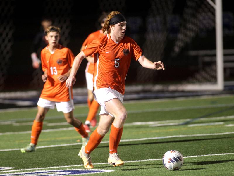 St. Charles East’s Jake Walker goes after the ball during a Tri-Cities Night game against St. Charles North at St. Charles North on Thursday, Sept. 21, 2023.