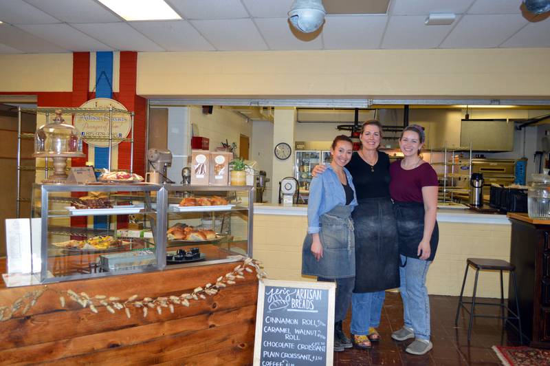 Jen's Artisan Breads owner Jen Koertner, center, poses for a photo with her employees, Kierra Moore, left, and Sarah Meacham in the bakery on Friday, Feb. 16, 2024.