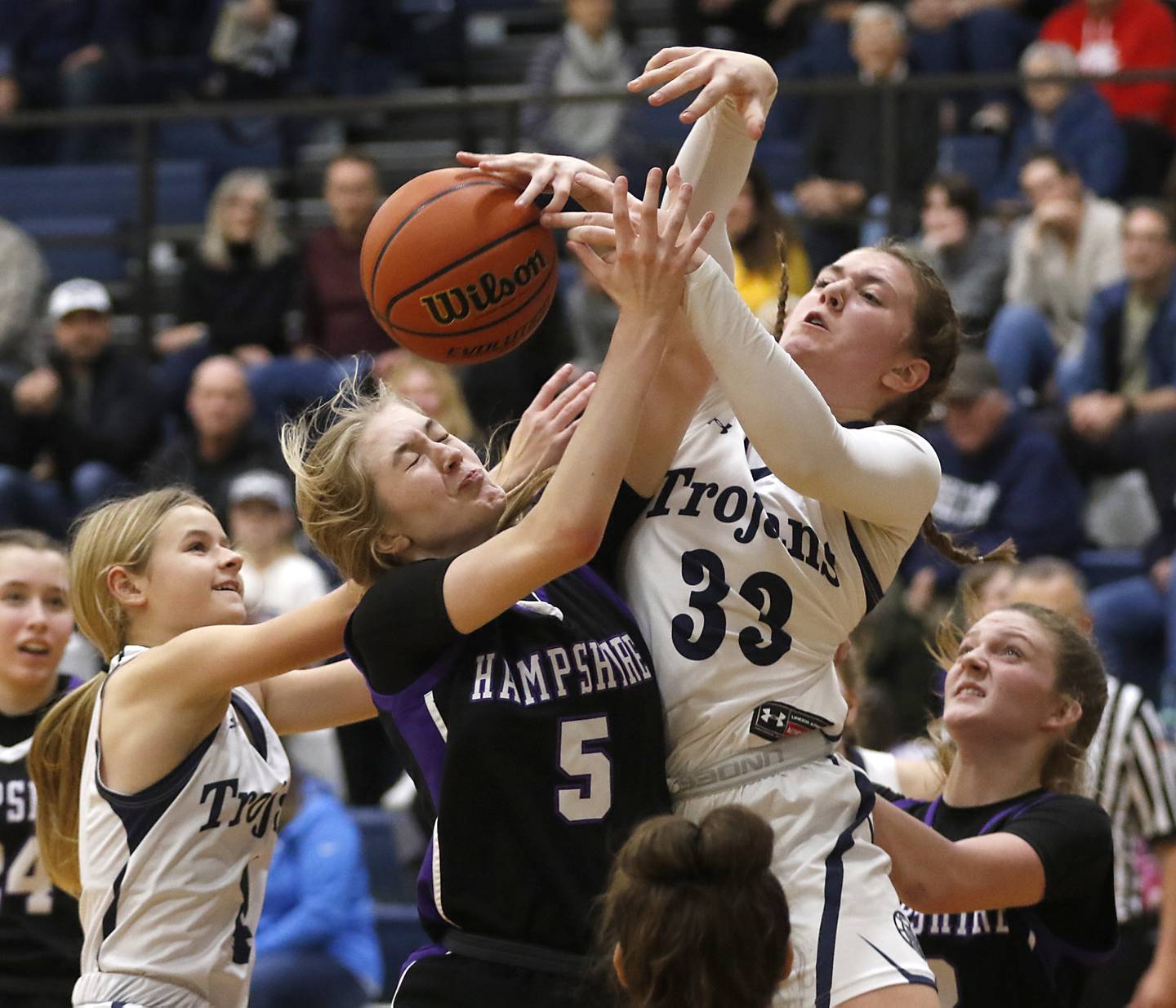 Hampshire's Avery Cartee, second from left, battles with Cary-Grove's Ellie Mjaanes second from right, for a rebound as their teammates, Cary-Grove's Aubrey Lonergan, left, and Hampshire's Kaitlyn Milison, right, tries to get to the ball during a Fox Valley Conference girls basketball game Friday, Dec.2, 2022, between Cary-Grove and Hampshire at Cary-Grove High School in Cary.