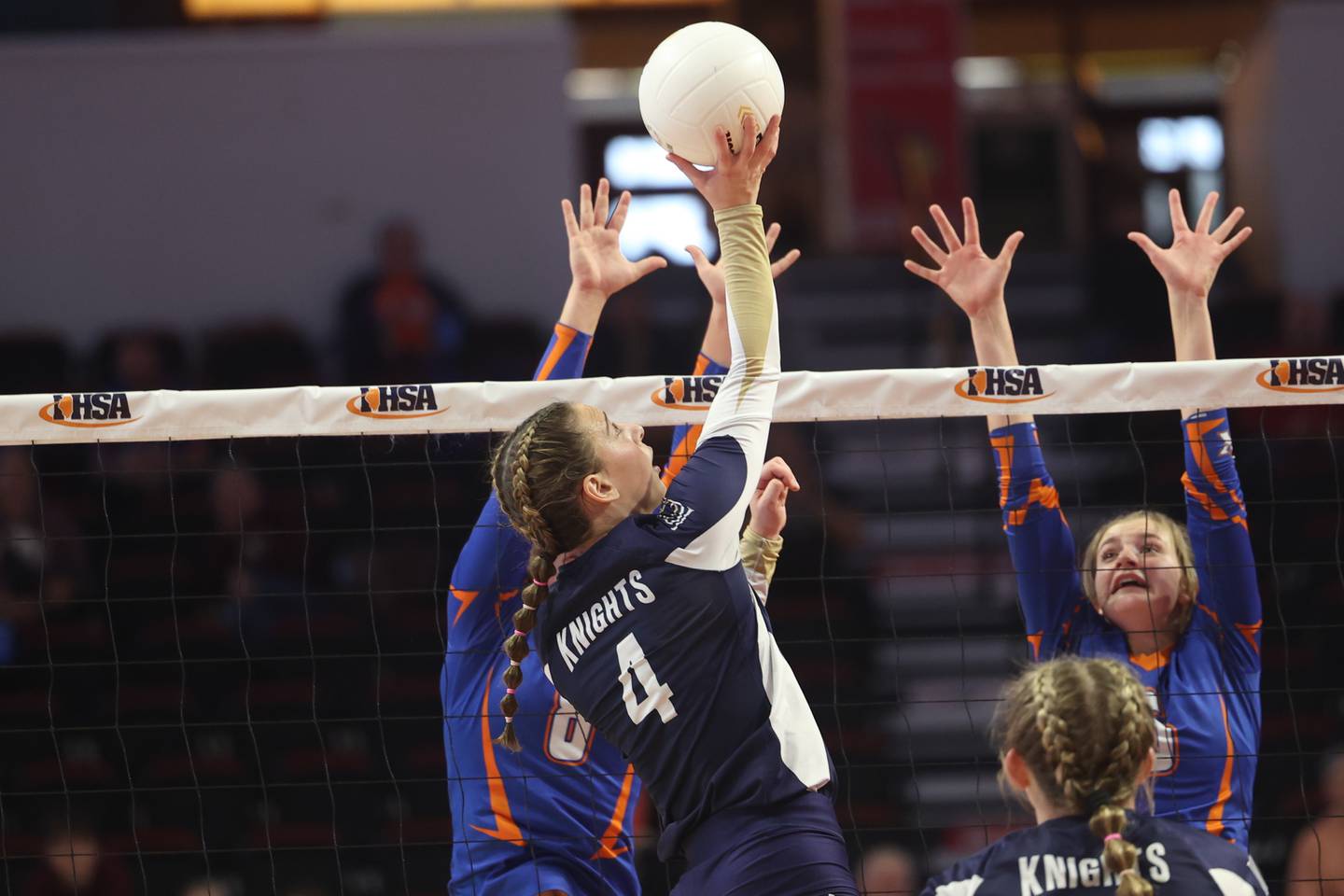 IC Catholic’s Ava Falduto pushes over a shot against the Genoa-Kingston block during the Class 2A championship match Saturday, Nov. 12, 2022, in Normal.