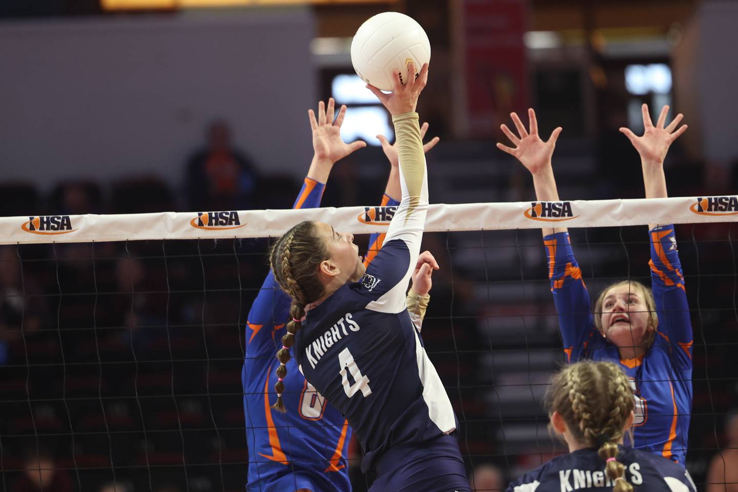 IC Catholic’s Ava Falduto pushes over a shot against the Genoa-Kingston block during the Class 2A championship match Saturday, Nov. 12, 2022, in Normal.