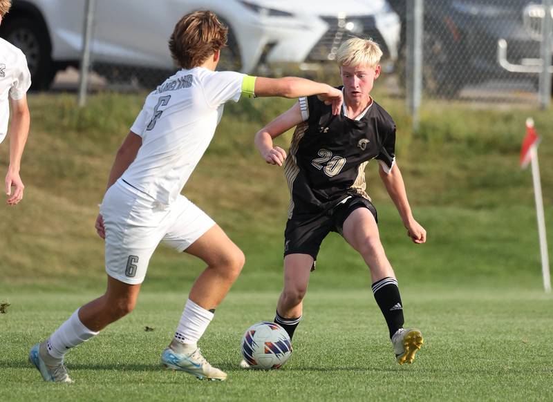 Sycamore's Paxton Nicol tries to get by Kaneland's Noah McKittrick during their game Wednesday, Sept. 18, 2024, at Sycamore High School.