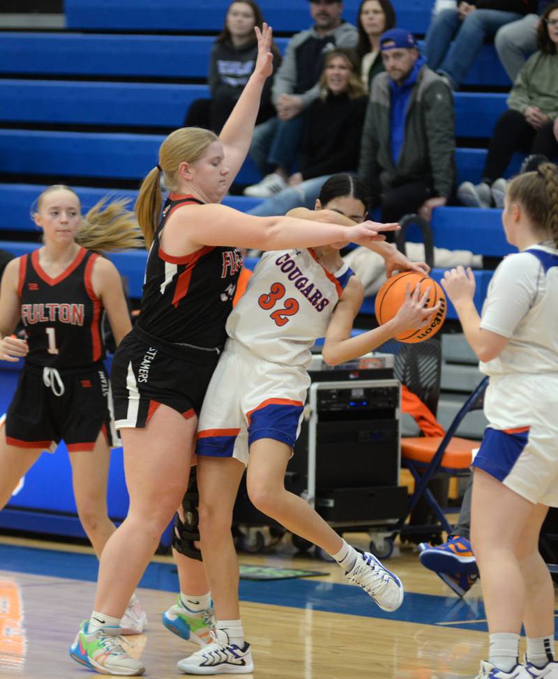 Eastland's Deyanise Nieves (32) protects the ball from Fulton's Kylie Smither on Friday, Dec. 13, 2024 at Eastland High School in Lanark.