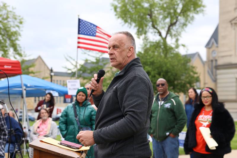 Larry Kerkstra, Kankakee County Board member, speaks during the May Day Strong rally at the Kankakee County Courthouse on May 1, 2026, as part of a national day of action.