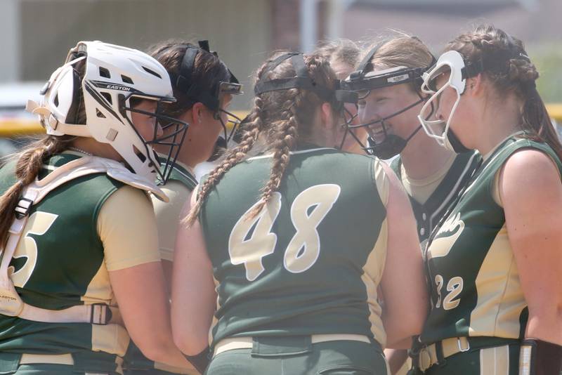 Members of the St. Bede softball team gather on the mound between innings against Annawan/Wethersfield in the Class 1A Regional final game on Saturday, May 20, 2023 in Annawan.