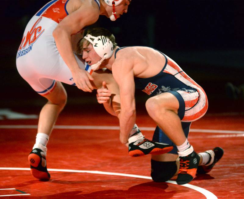 Morrison's Brady Anderson (right) lifts his Oregon opponent during a 165-pound match at a triangular meet with Oregon on Friday, Jan. 31, 2025 in the Blackhawk Center at Oregon High School.
