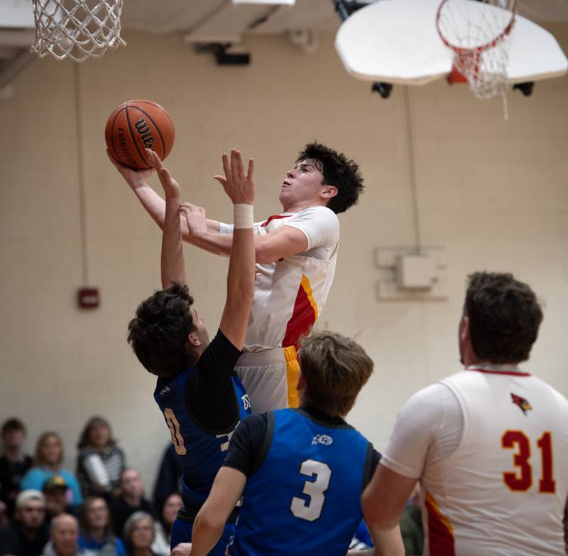 St. Anne's Matthew Langellier elevates for a lay up as Clifton Central's Derek Meier guards in the RVC Tournament Championship on Friday, Feb. 13, 2026.