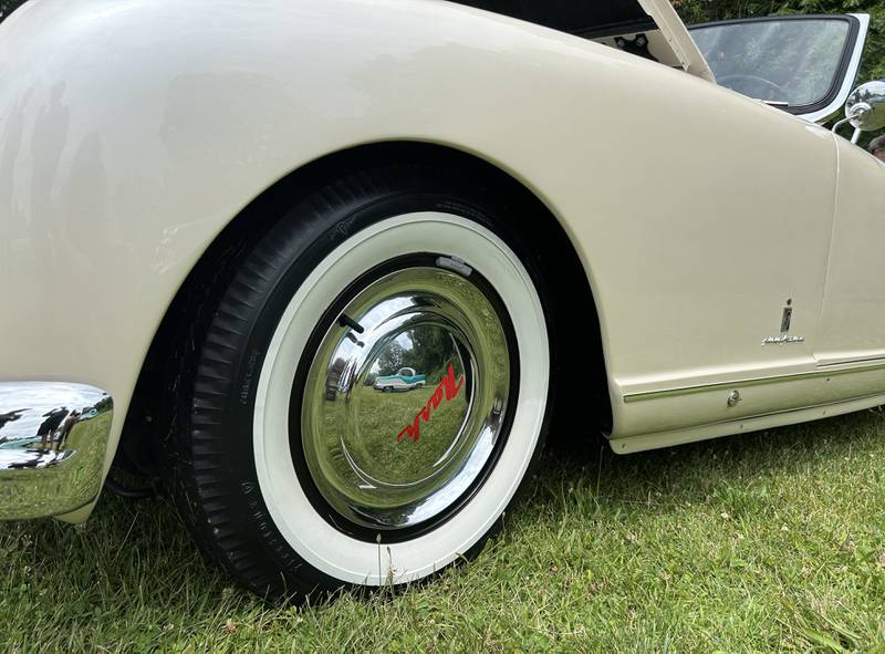A Nash Metropolitan is reflected in a hub camp of Tom and Lisa VandeWettering's, 1952 Nash Healey at the Nashional Car Show at the Stronghold Camp & Retreat Center north of Oregon on Saturday, June 29, 2024.