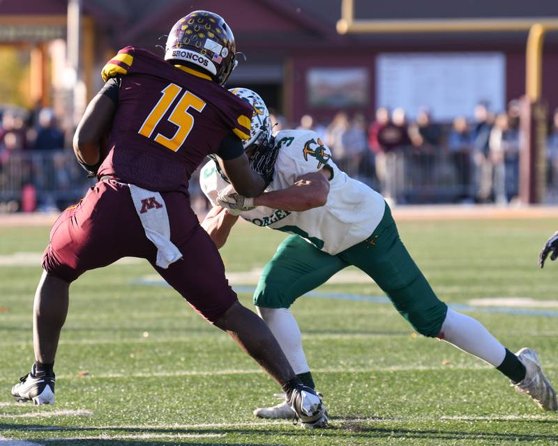 Coal City's Brody Widlowski (3) pushes Montini Catholic's ball carrier Charles Flowers (15) out of bounds before gaining extra yards on Saturday Nov. 15, 2025, during the 4A quarterfinals game held at Montini Catholic High School.
