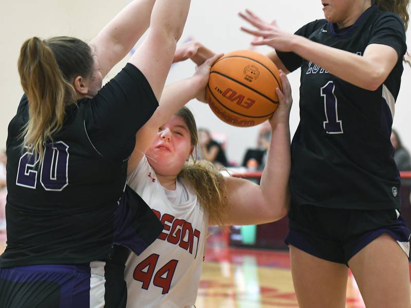 Oregon's Noelle Girton (44) battles two Rockford Lutheran players for a rebound on Saturday, Jan. 24, 2026 at the Blackhawk Center in Oregon.