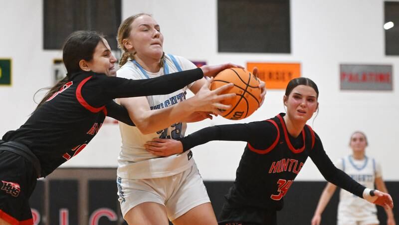 Prospect’s Alli Linke tries to drive between Huntley defenders Alyssa Borzych, left, and Ava McFadden during a game played at Forest View Educational Center on Saturday, Jan. 4, 2025 in Arlington Heights.