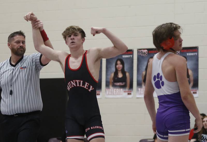 Huntley’s Shane McGuine celebrates defeating  Hampshire's Aric Abbott in the 150-pound match of a Fox Valley Conference wrestling match Wednesday, Jan. 24, 2024, at Huntley High School.