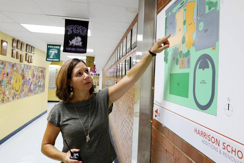 Harrison School District 36 Superintendent Sue Wings shows some of the improvements to Harrison Elementary School on Thursday in Wonder Lake.