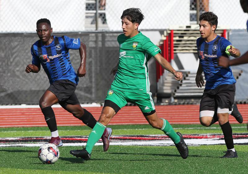 DeKalb County United's Oscar Montejano splits two Rockford FC defenders during their game Saturday, July 29, 2023, at the Soccer & Track and Field Complex at Northern Illinois University in DeKalb.