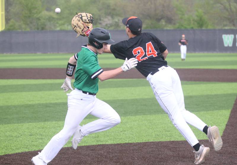 Seneca's Griffin Hougas beats out the throw to Roanoke-Benson/Lowpoint-Washburn's Jonah Sauder at first base on Thursday, May 1, 2025 at Seneca High School.