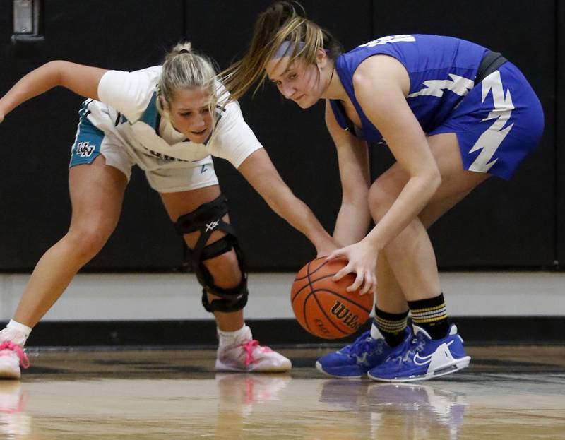 Woodstock North’s Addison Rishling tries to steal the ball from Woodstock's Savannah Griffin during a Kishwaukee River Conference girls basketball game on Friday, Jan. 5. 2024, at Woodstock North High School.
