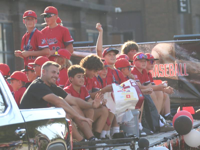 The Peru youth baseball team rides during the L-P homecoming parade on Thursday, Oct. 2, 2025 downtown Peru.