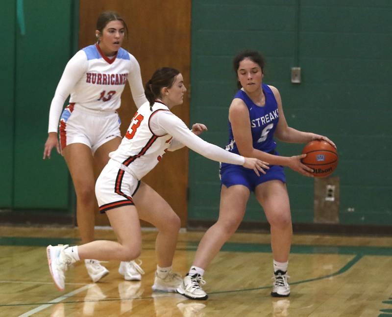 Crystal Lake Central's Kathryn Hamill tries to steal the ball away from Woodstock’s Natalie Morrow during the girl’s game of McHenry County Area All-Star Basketball Extravaganza on Sunday, April 14, 2024, at Alden-Hebron’s Tigard Gymnasium in Hebron.