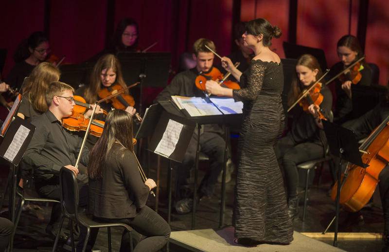 Orchestra director Allison Lisa conducts in the Kaleidoscope Concert featuring all music and choir students at Batavia High School Nov. 28, 2011,  in Batavia Fine Arts Center.